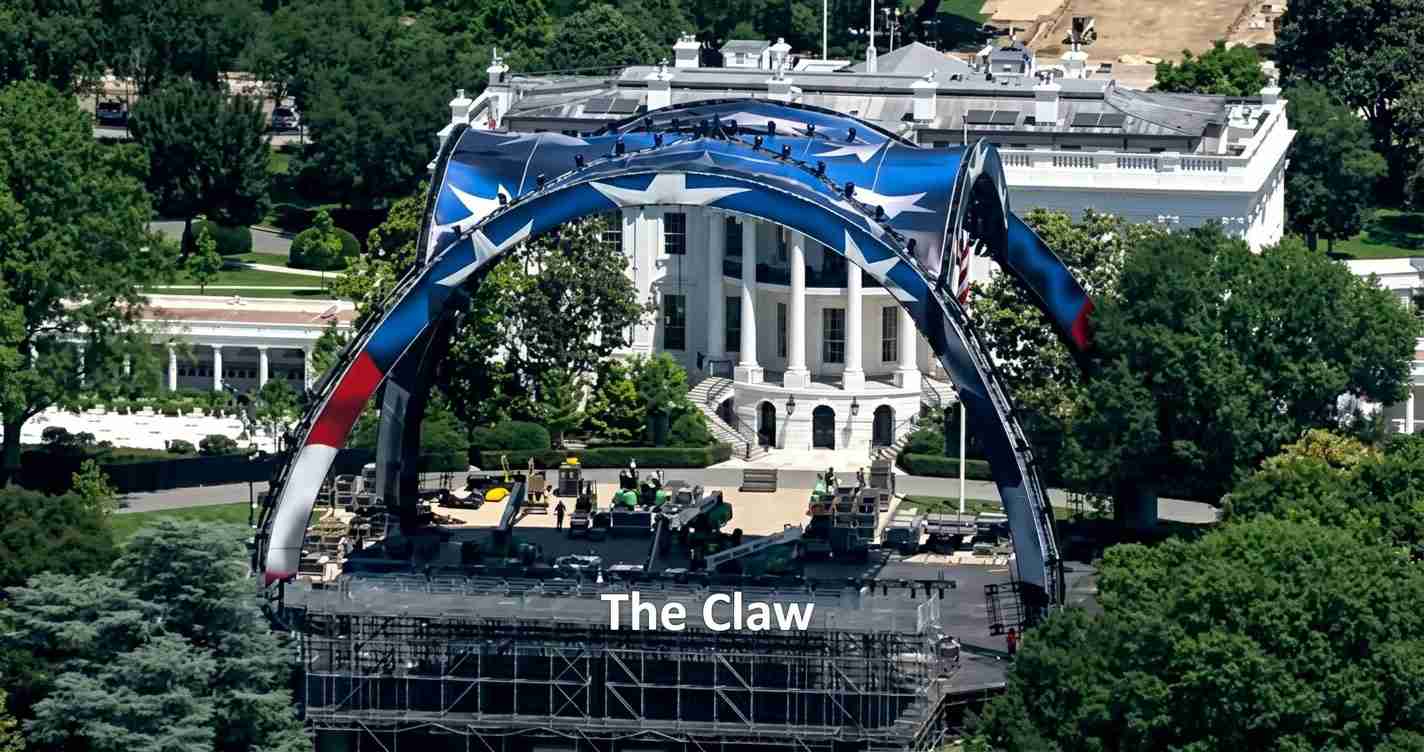 Outdoor concert stage built in front of the White House, framed by a giant curved arch painted red, white, and blue labeled 'The Claw'