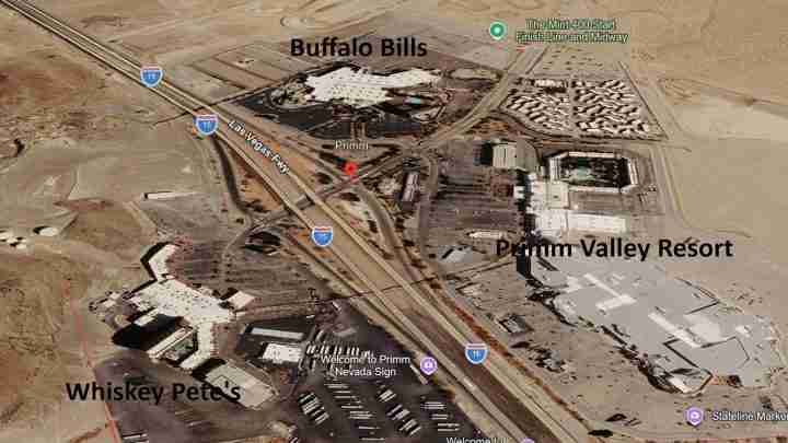 Aerial satellite view of Primm, Nevada showing Primm Valley Resort and Whiskey Pete's along I-15 near Las Vegas, with Buffalo Bills landmark.