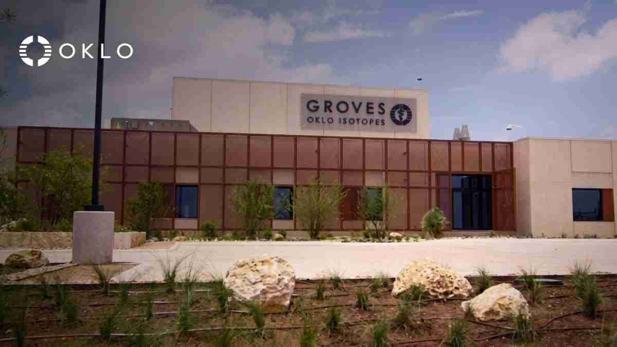 Oklo building with Groves Oklo Isotopes sign, desert landscaping and large rocks in front.